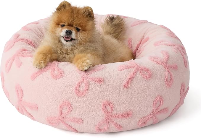 LE SURE Donut Small Dog Bed - Round Cat Beds for Indoor Cats, Washable Calming Pet Beds with Teddy Sherpa Plush & Anti Slip Bottom (Bow Pink Taffy, S Plus (27x27x8))